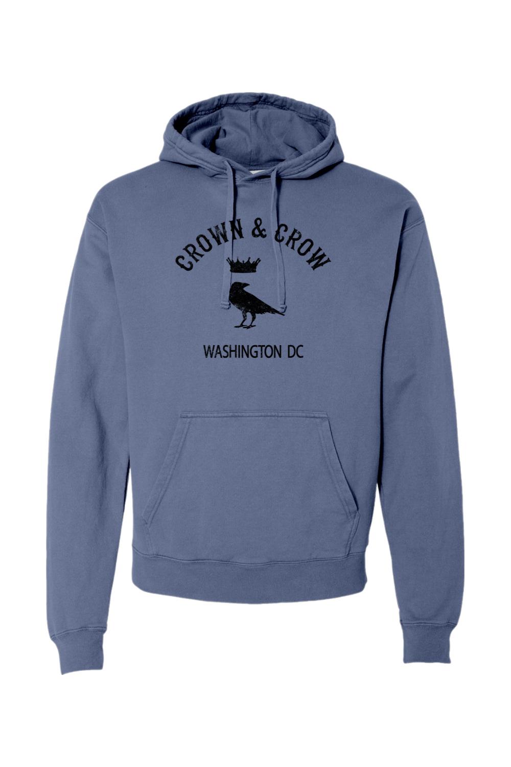 Blue garment-dyed cotton hoodie featuring a black Crown and Crow logo with Washington DC text on the front.