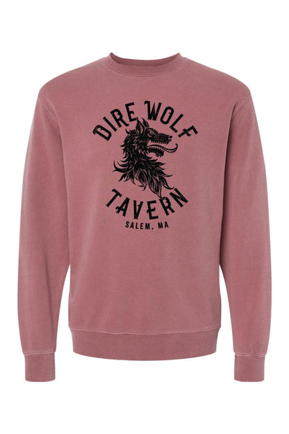 Dusty rose pigment-dyed crewneck sweatshirt featuring a black Dire Wolf Tavern graphic on the chest.