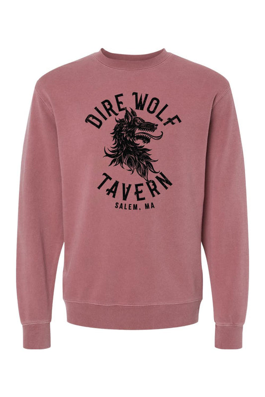 Dusty rose pigment-dyed crewneck sweatshirt featuring a black Dire Wolf Tavern graphic on the chest.