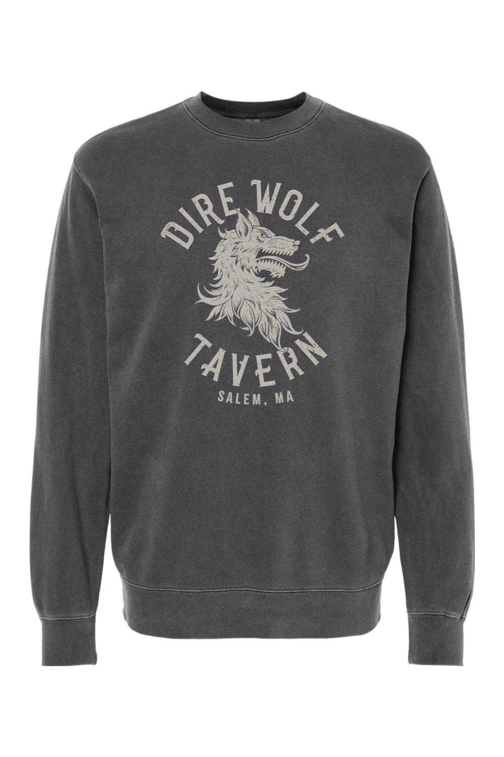 Charcoal pigment-dyed crewneck sweatshirt featuring a vintage-style Dire Wolf Tavern logo graphic on the chest.