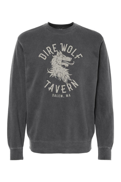 Charcoal pigment-dyed crewneck sweatshirt featuring a vintage-style Dire Wolf Tavern logo graphic on the chest.