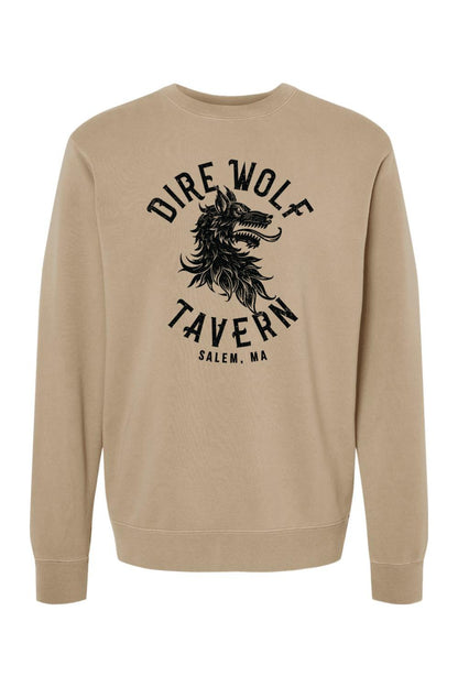 Tan pigment-dyed crewneck sweatshirt featuring a black Dire Wolf Tavern logo graphic on the chest.