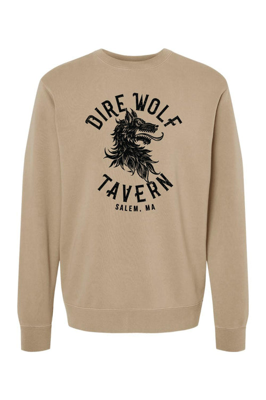 Tan pigment-dyed crewneck sweatshirt featuring a black Dire Wolf Tavern logo graphic on the chest.