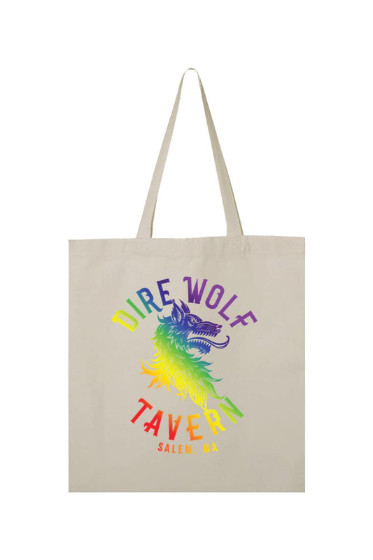 Natural canvas tote bag featuring a rainbow-colored Dire Wolf Tavern logo and Salem, MA text on the front.