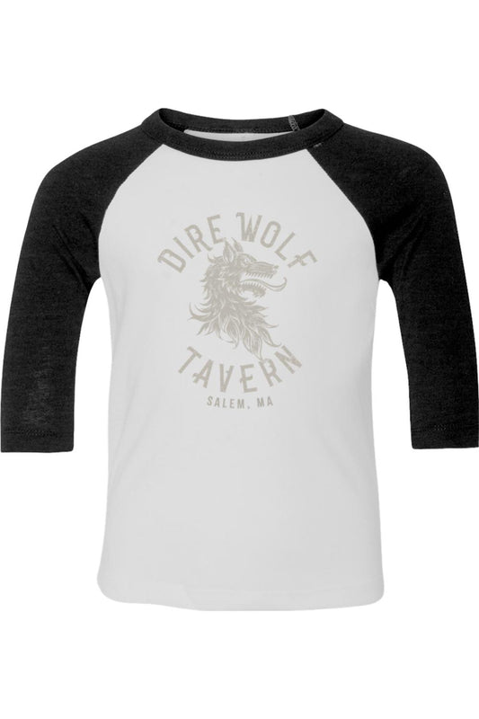 Toddler baseball t-shirt with white body, black three-quarter sleeves, and a Dire Wolf Tavern graphic print.