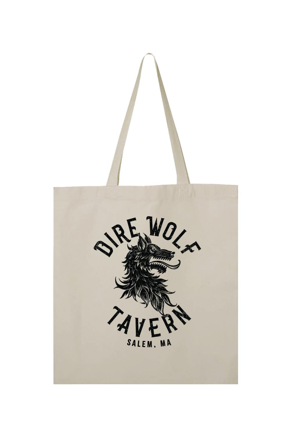 Natural canvas tote bag featuring a black Dire Wolf Tavern Salem, MA graphic print on the front.