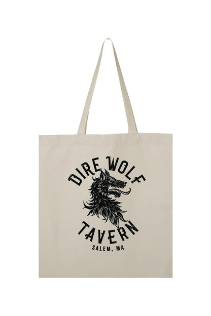 Natural canvas tote bag featuring a black Dire Wolf Tavern Salem, MA graphic print on the front.