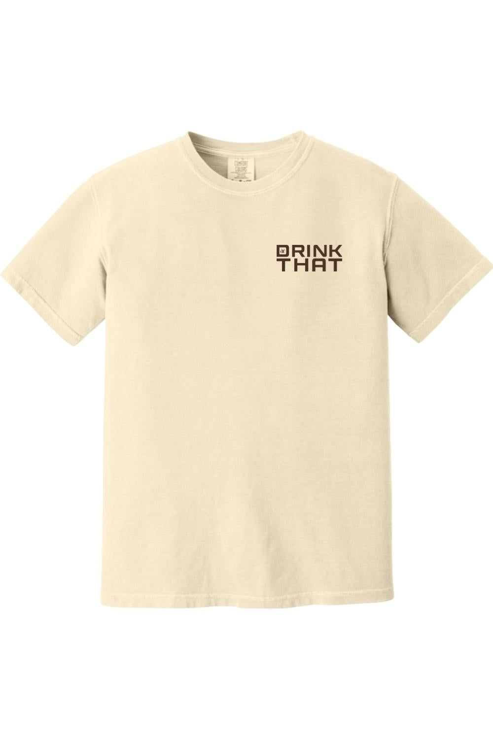 Cream-colored Comfort Colors unisex t-shirt featuring a small black Drink That logo on the left chest.