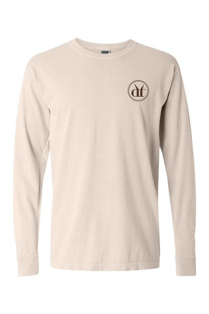Beige Comfort Colors long sleeve cotton t-shirt featuring a circular Drink That espresso martini logo on the chest.