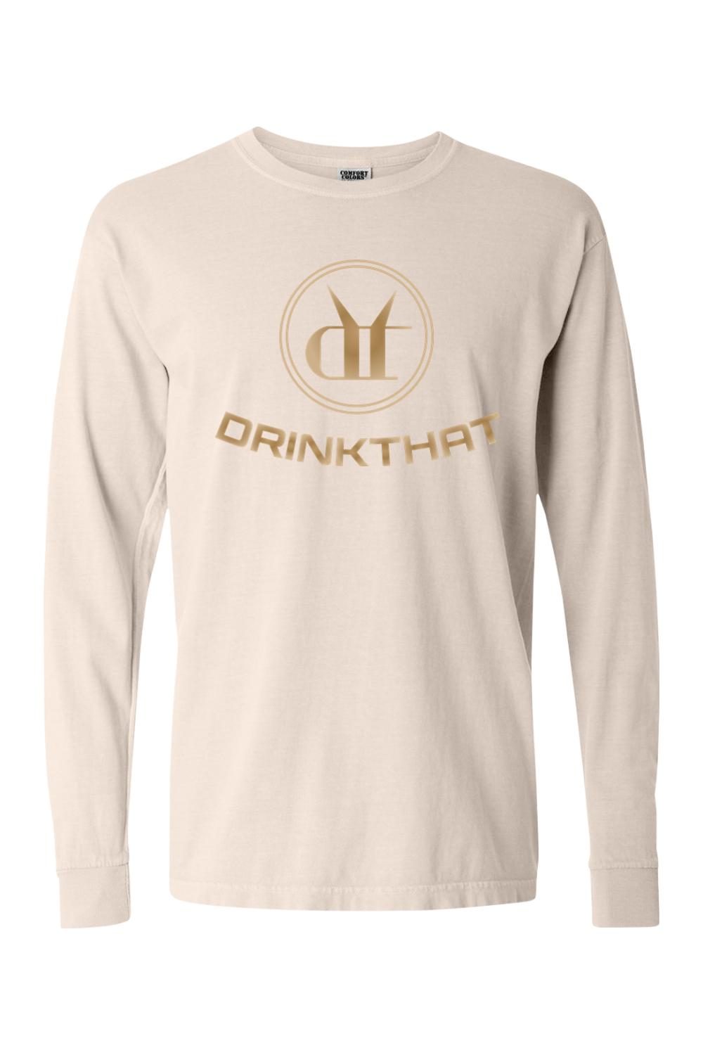 Beige Comfort Colors long sleeve t-shirt featuring a gold Drink That logo graphic on the chest.