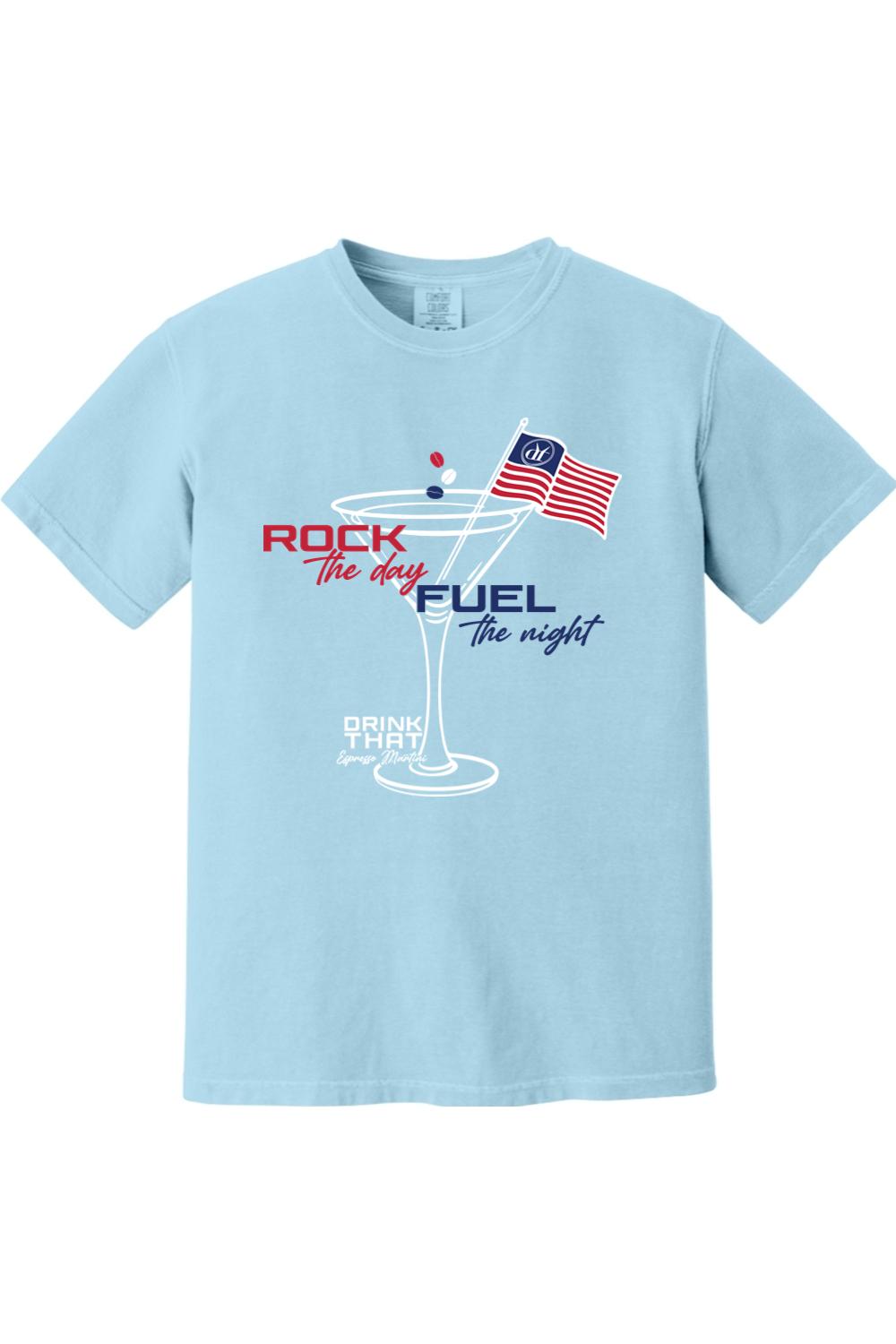 Light blue Comfort Colors cotton t-shirt featuring a martini glass graphic with an American flag and text design.