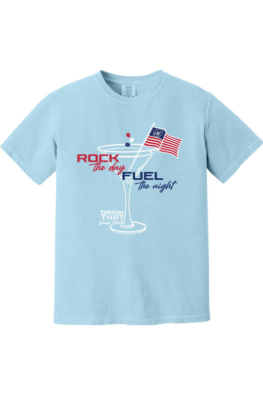 Light blue Comfort Colors cotton t-shirt featuring a martini glass graphic with an American flag and text design.