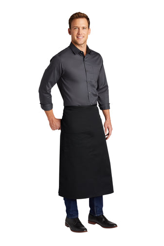 Man wearing a black poly/cotton twill full bistro apron with a large front pocket and pen slot.