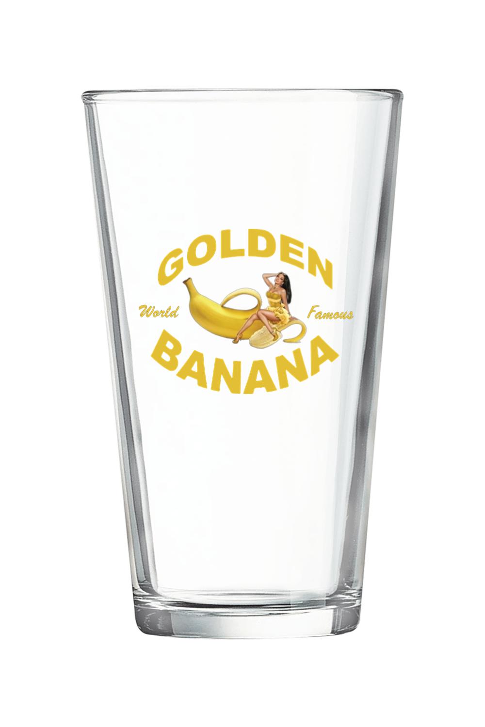 Clear 16 oz. pint glass featuring a Golden Banana logo with a pin-up girl graphic in yellow text.