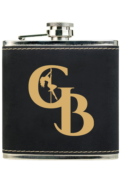 Black leatherette stainless steel flask with a gold engraved Golden Banana logo and pole dancer design.