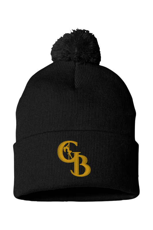 Black knit beanie with a pom-pom top and embroidered golden GB logo featuring a pole dancer silhouette.