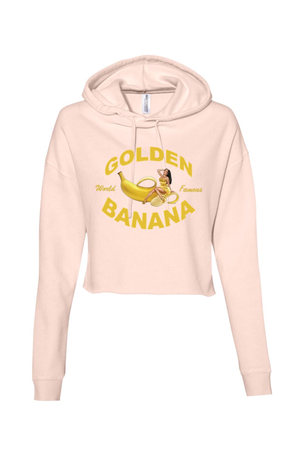 Light pink cropped hooded sweatshirt featuring a yellow Golden Banana graphic with a pin-up style woman.