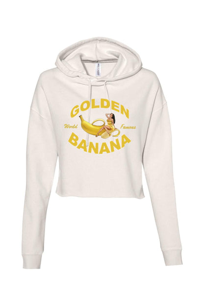 Cream-colored cropped hooded sweatshirt with a Golden Banana graphic print on the front.