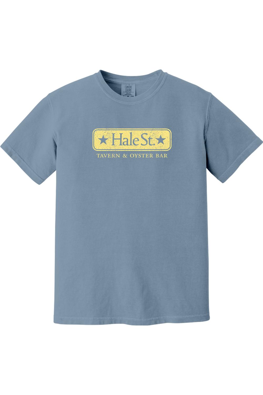 Blue Comfort Colors short-sleeve t-shirt featuring a distressed yellow Hale St. Tavern & Oyster Bar logo graphic.