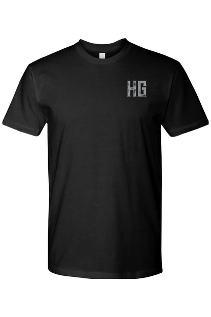 Black 100% cotton crew neck t-shirt featuring a small, distressed grey HG logo on the left chest.