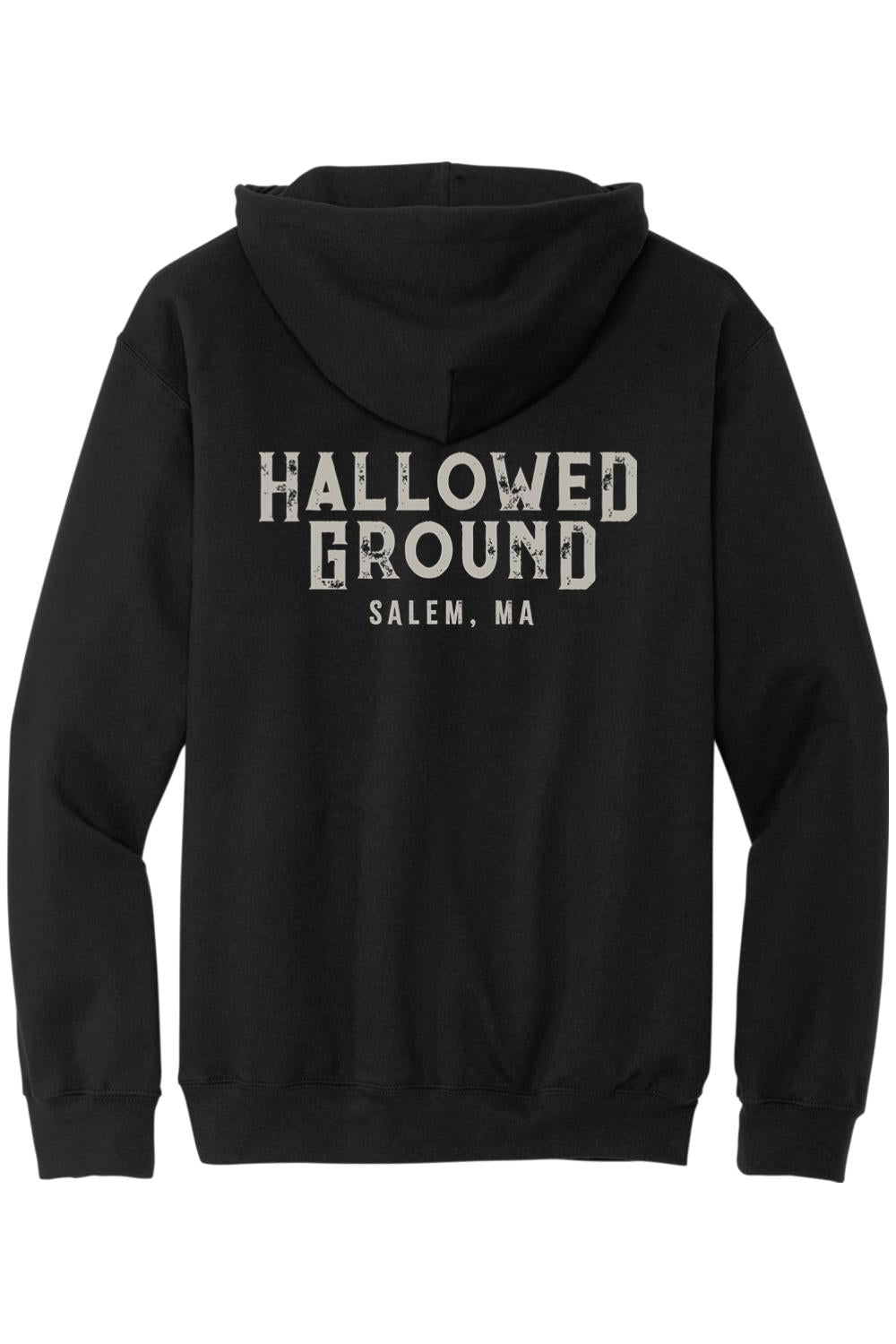 Black zip-up hoodie featuring Hallowed Ground Salem, MA distressed white text on the back.