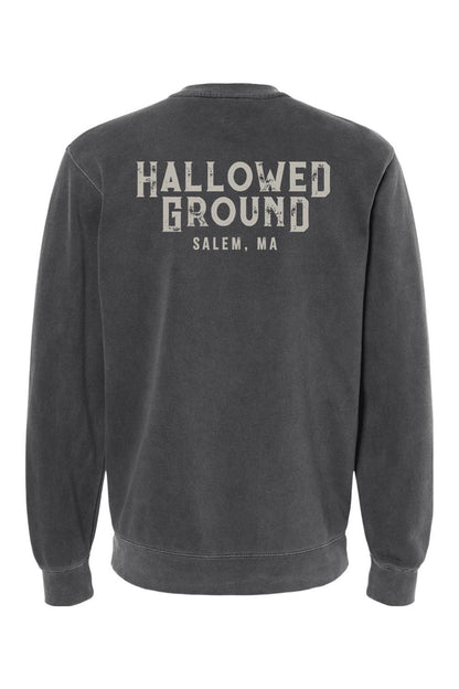 Charcoal pigment-dyed crewneck sweatshirt featuring Hallowed Ground Salem, MA text graphic on the back.