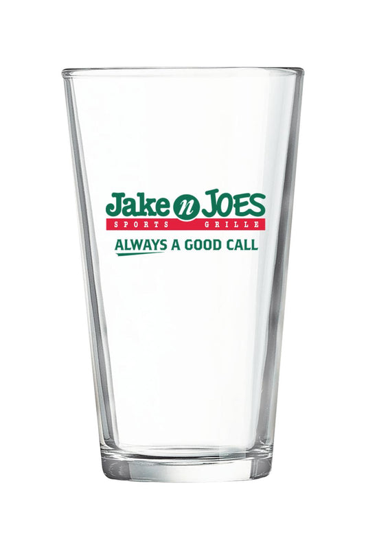 Clear 16 oz. pint mixing glass featuring the green and red Jake n JOES Sports Grille logo on the front.