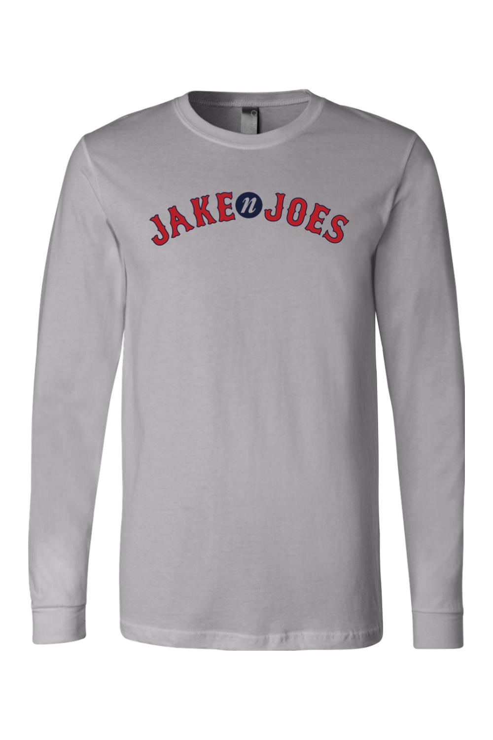 Light gray long-sleeve cotton t-shirt featuring a red and blue Jake n JOES baseball-style logo on the chest.