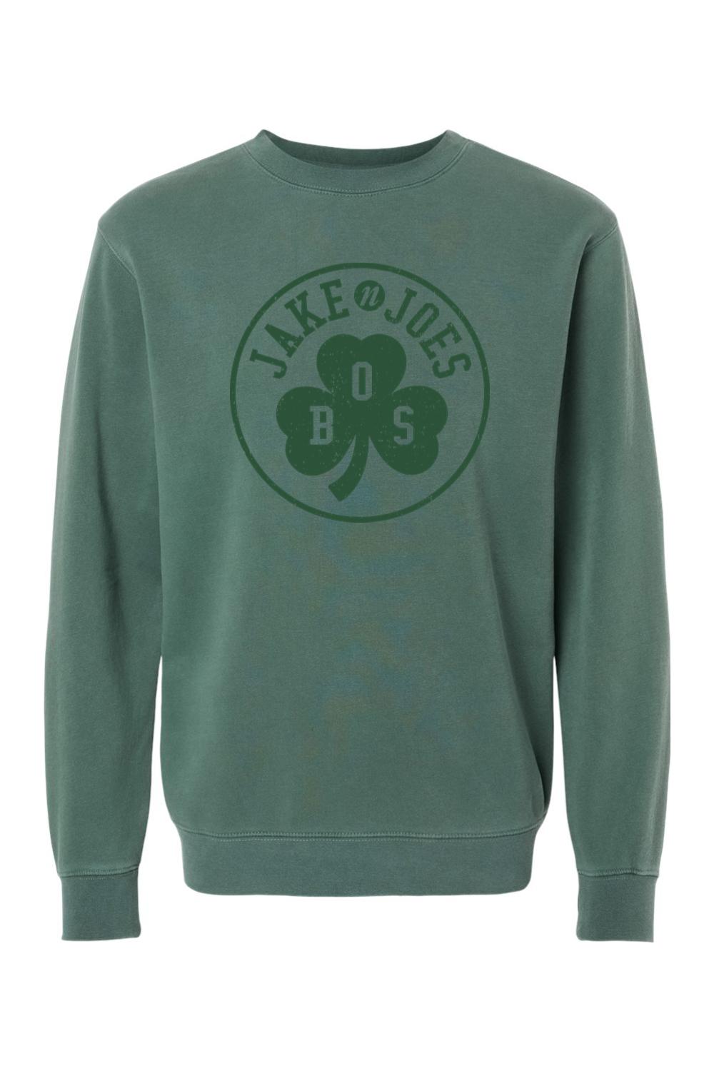 Green pigment-dyed crewneck sweatshirt featuring a Jake n JOES Boston shamrock graphic on the chest.