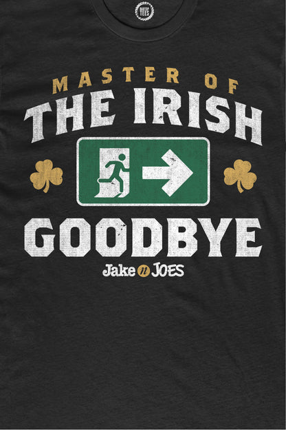 Black cotton t-shirt featuring Master of the Irish Goodbye text, a green exit sign graphic, and gold shamrocks.