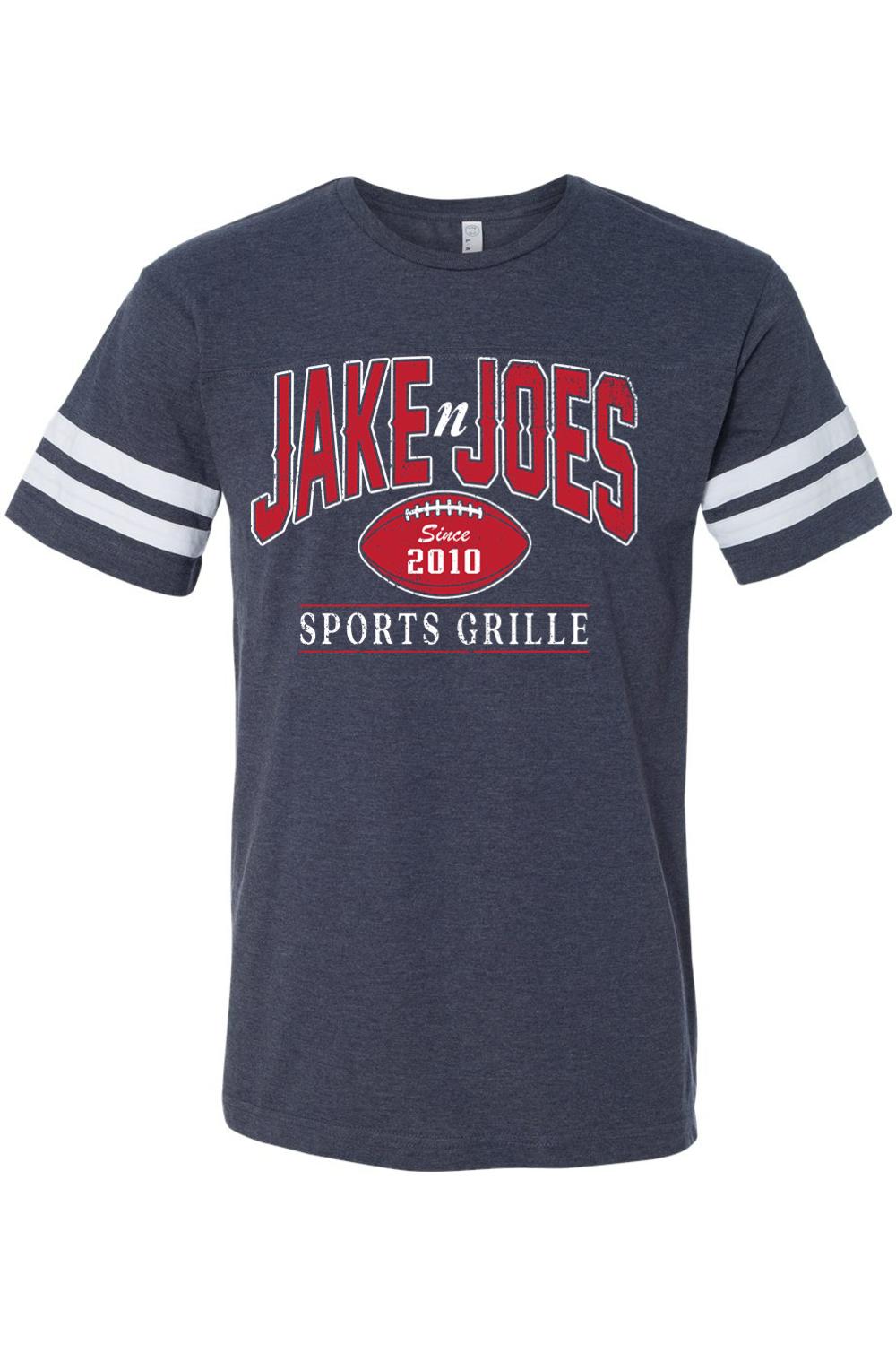 Navy blue cotton football jersey tee with white sleeve stripes and red and white Jake n JOES Sports Grille logo.