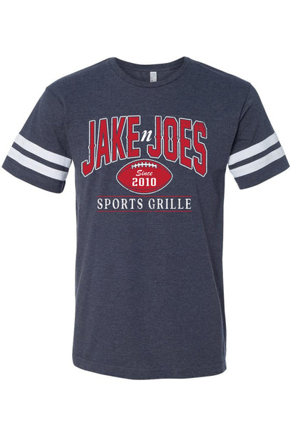 Navy blue cotton football jersey tee with white sleeve stripes and red and white Jake n JOES Sports Grille logo.