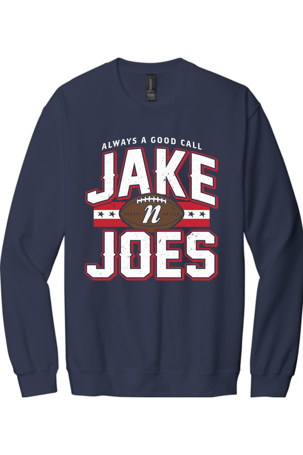 Navy blue crewneck sweatshirt featuring a white and red Jake n JOES football graphic on the chest.