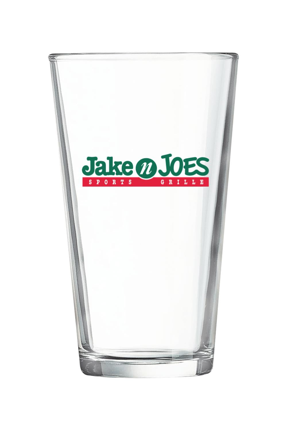 Clear 16-ounce pint glass featuring the green and red Jake n JOES Sports Grille logo on the front.