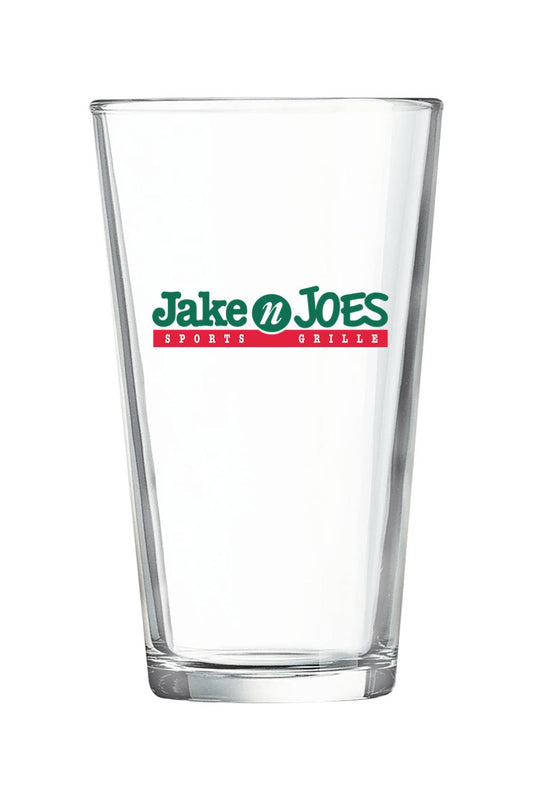 Clear 16-ounce pint glass featuring the green and red Jake n JOES Sports Grille logo on the front.