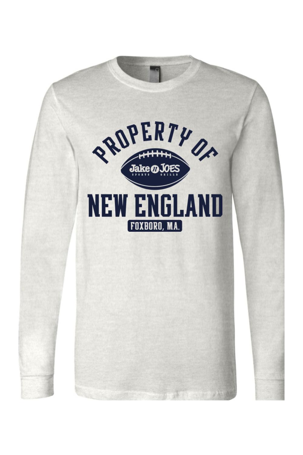 Light grey long sleeve cotton t-shirt featuring a navy blue Property of New England football graphic on the chest.