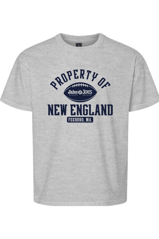 Youth grey cotton t-shirt featuring a navy blue Property of New England football graphic with Jake n JOES branding.