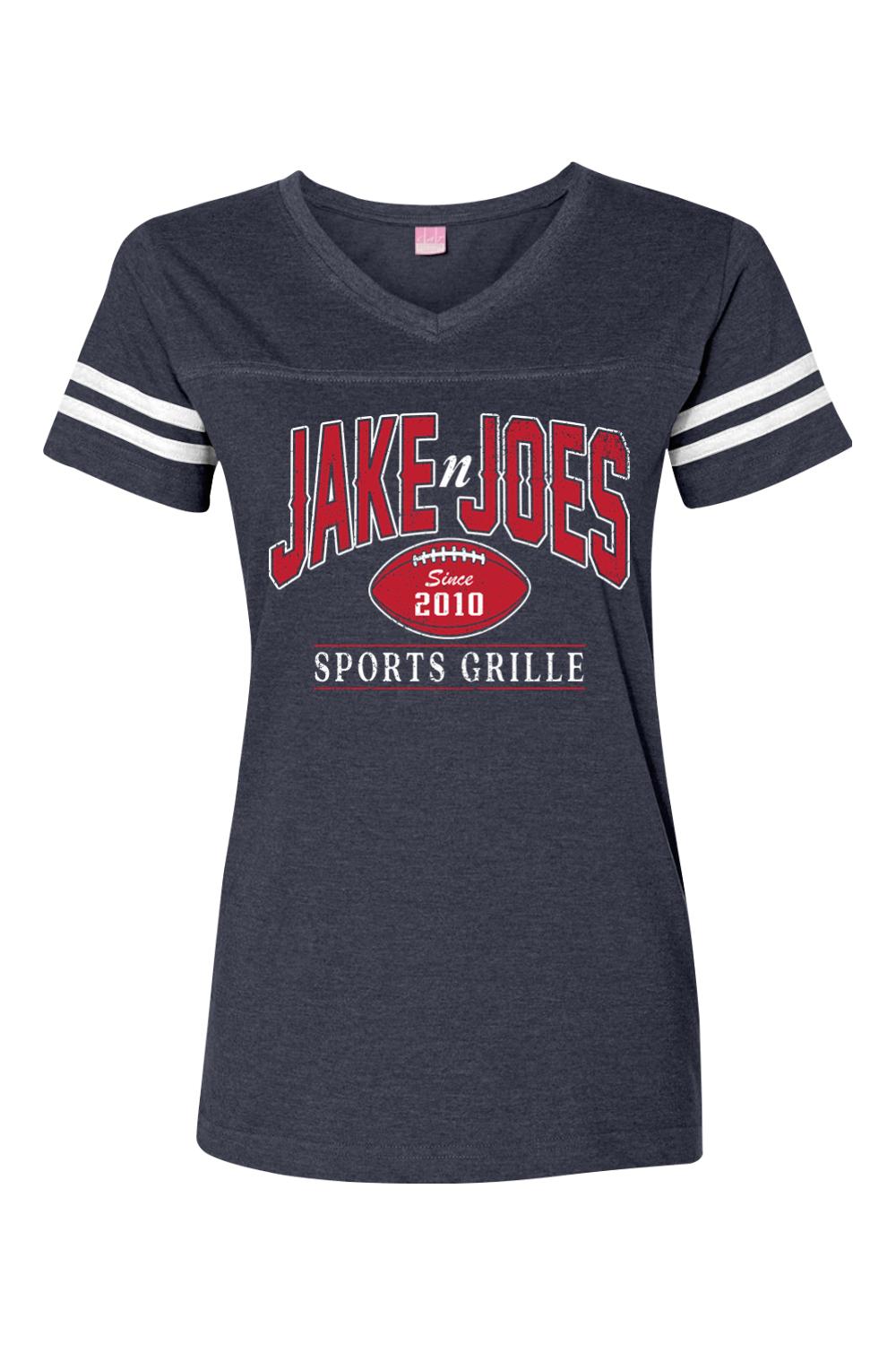 Charcoal grey women's V-neck football jersey tee with white striped sleeves and Jake n JOES sports logo graphic.