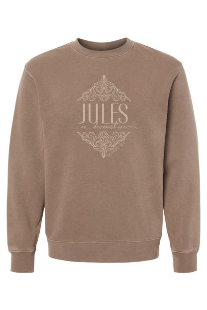 Brown pigment-dyed crewneck sweatshirt featuring a Jules on Devonshire floral graphic print on the chest.