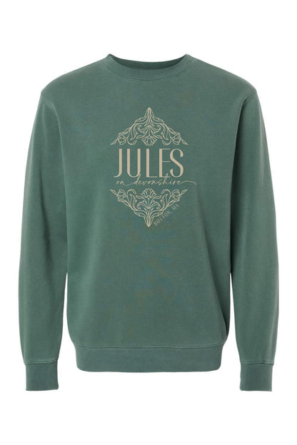 Pigment-dyed forest green crewneck sweatshirt featuring a cream-colored Jules on Devonshire Boston, MA floral graphic.