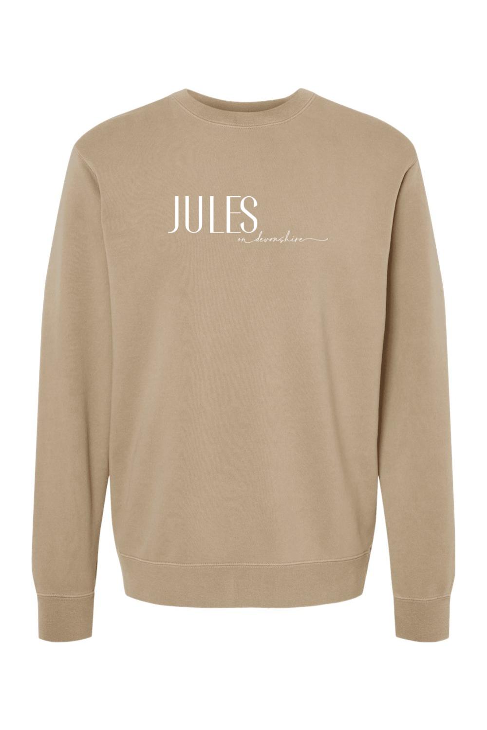 Tan pigment-dyed crewneck sweatshirt with white Jules on Devonshire logo text on the chest.