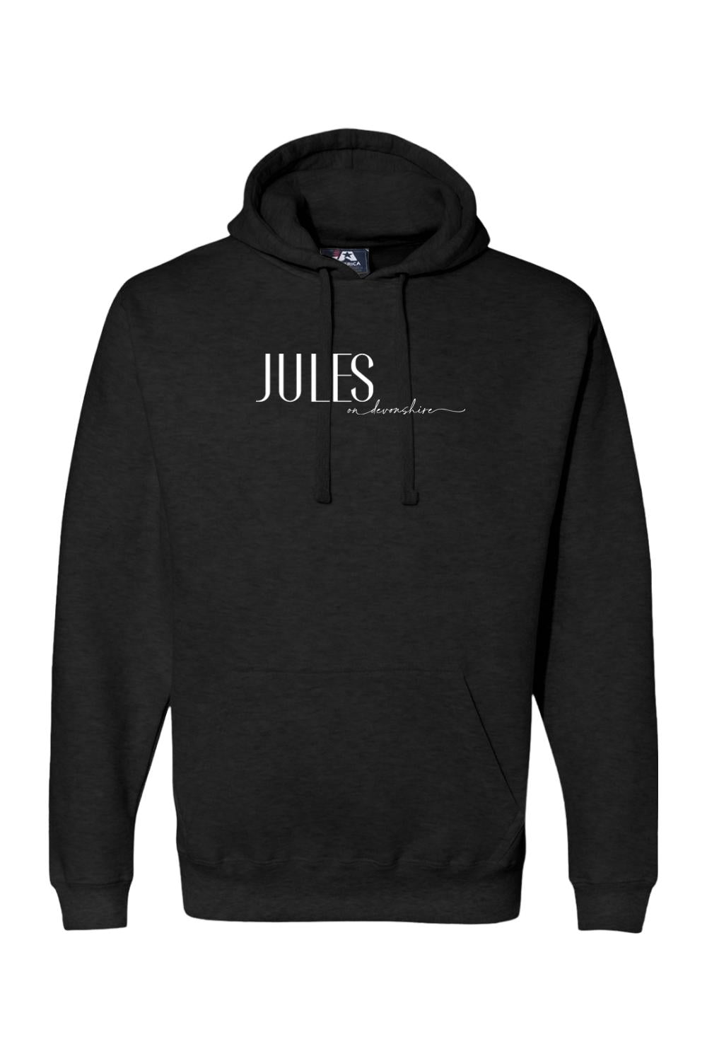 Black premium hoodie featuring a white Jules on Devonshire logo, drawstring hood, and front kangaroo pocket.
