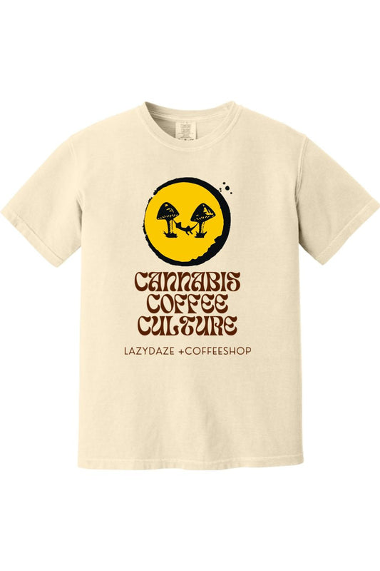 Cream-colored garment-dyed cotton t-shirt featuring a yellow circle graphic with mushroom and hammock print.