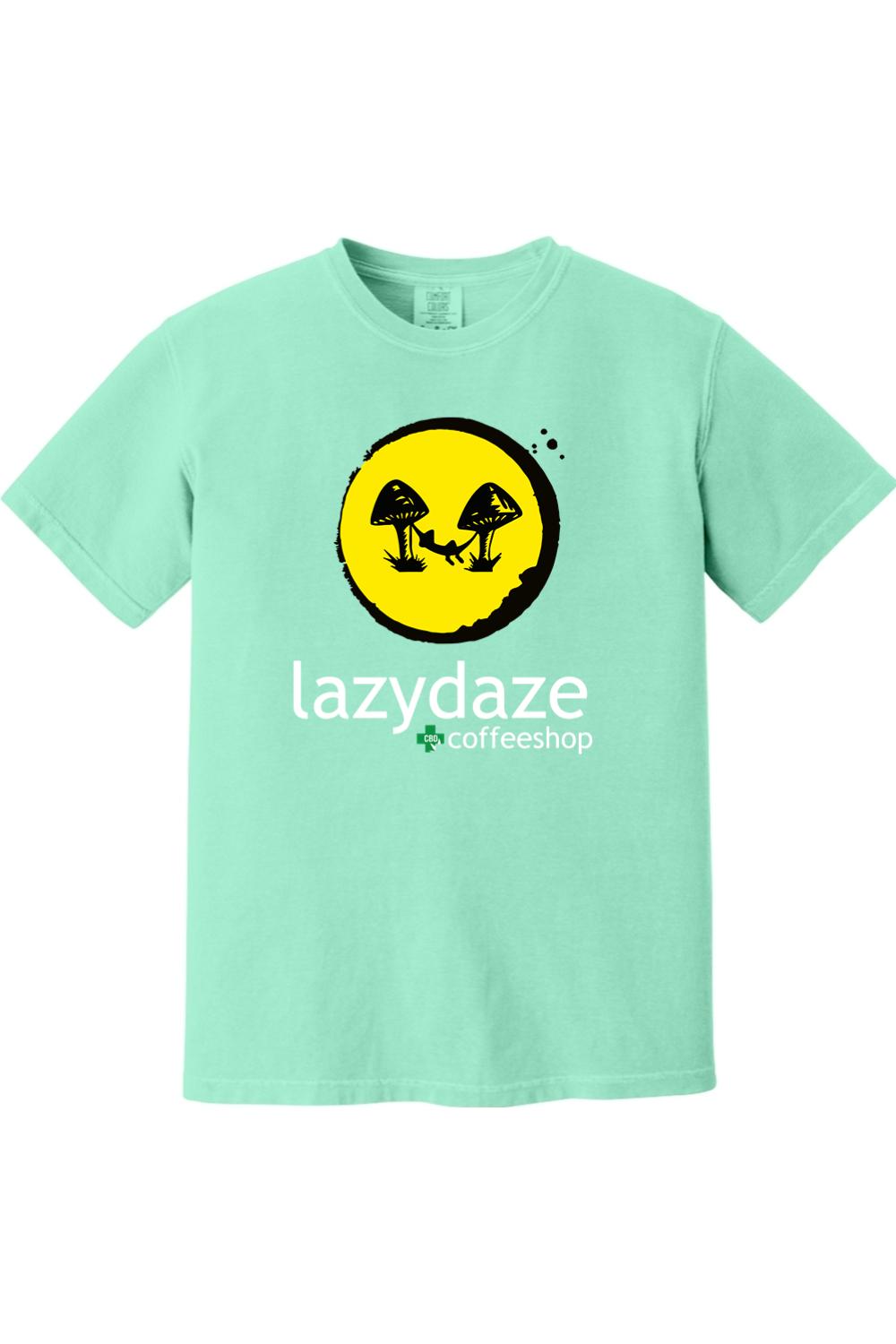 Mint green soft cotton t-shirt featuring a yellow circle graphic with a mushroom hammock design and Lazy Daze logo.