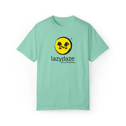 Mint green relaxed-fit cotton t-shirt featuring a yellow circle logo with black mushrooms and Lazy Daze text.