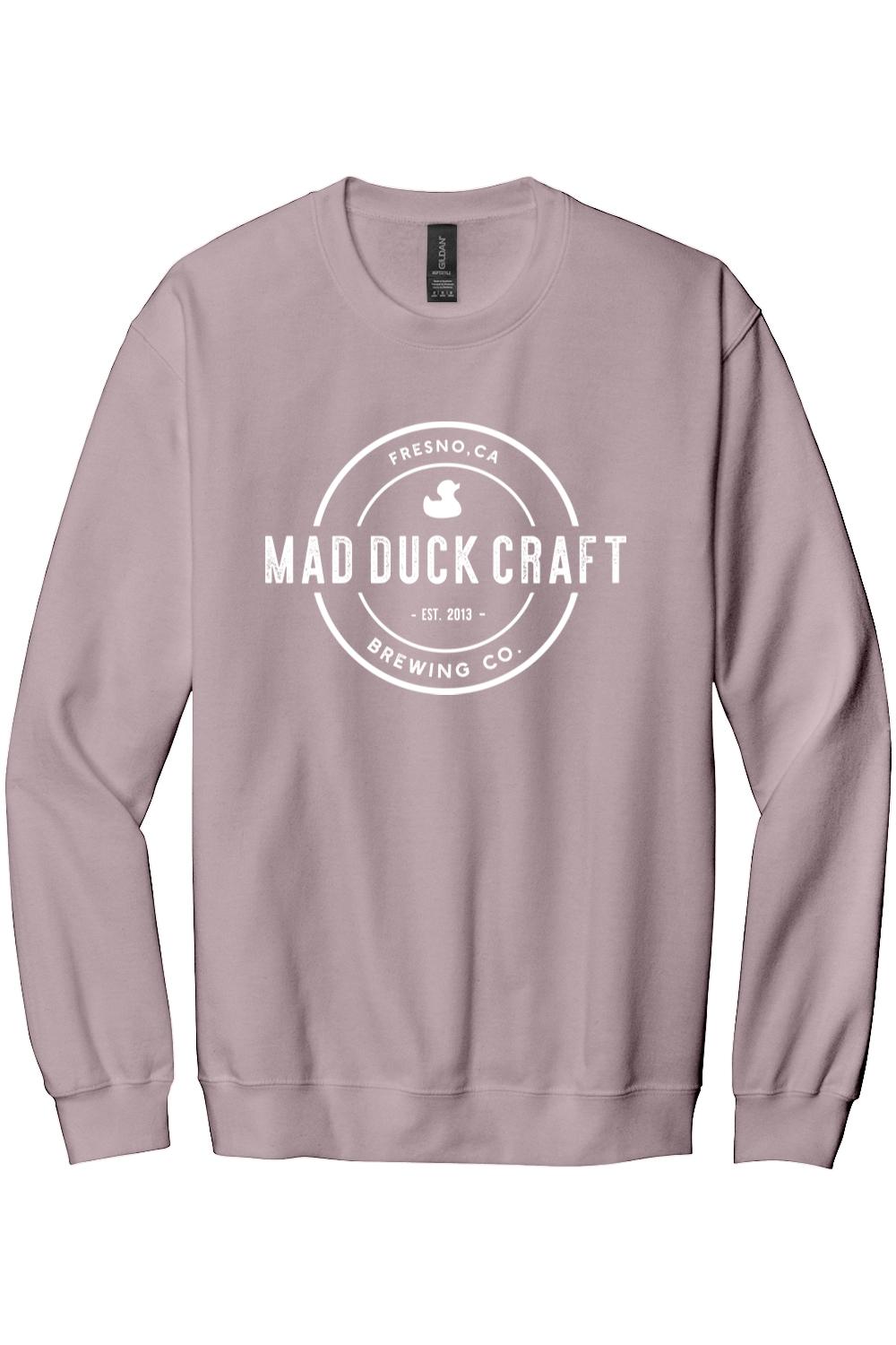 Dusty rose crewneck sweatshirt featuring a white Mad Duck Craft Brewing Co. logo printed on the front.