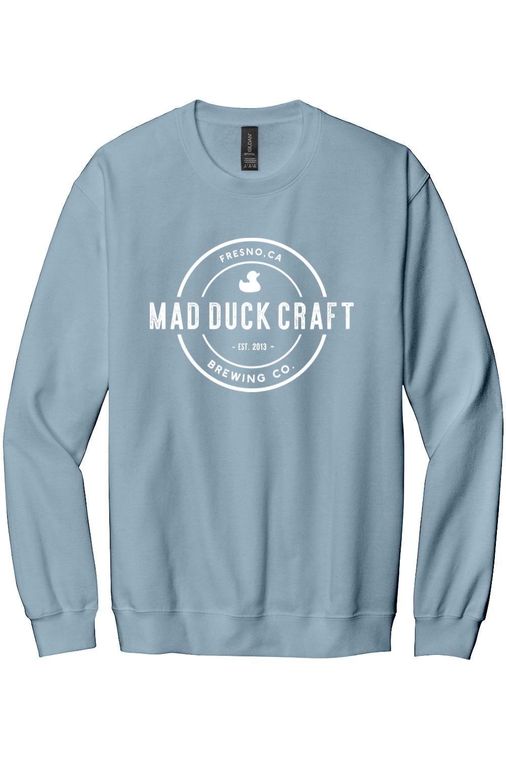 Light blue crewneck sweatshirt featuring a white Mad Duck Craft Brewing Co. logo graphic on the chest.