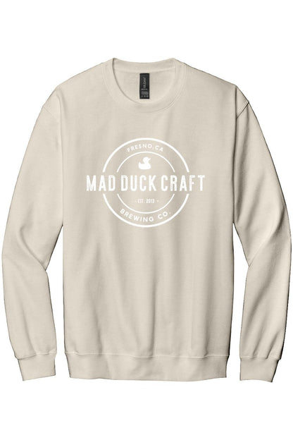 Beige crewneck sweatshirt featuring a white Mad Duck Craft Brewing Co. logo printed on the front chest.