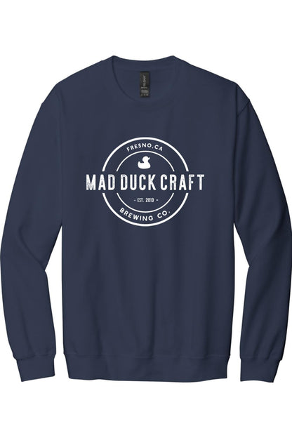 Navy blue crewneck sweatshirt featuring a white circular Mad Duck Craft Brewing Co. logo on the chest.