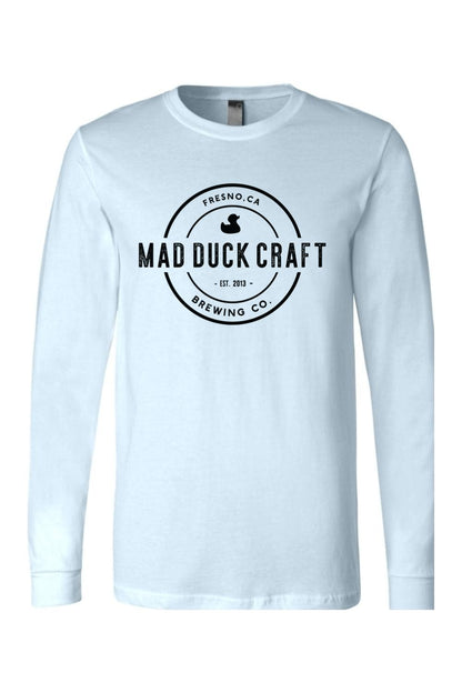 Light blue long sleeve jersey tee featuring a black Mad Duck Craft Brewing Co. circular logo on the chest.